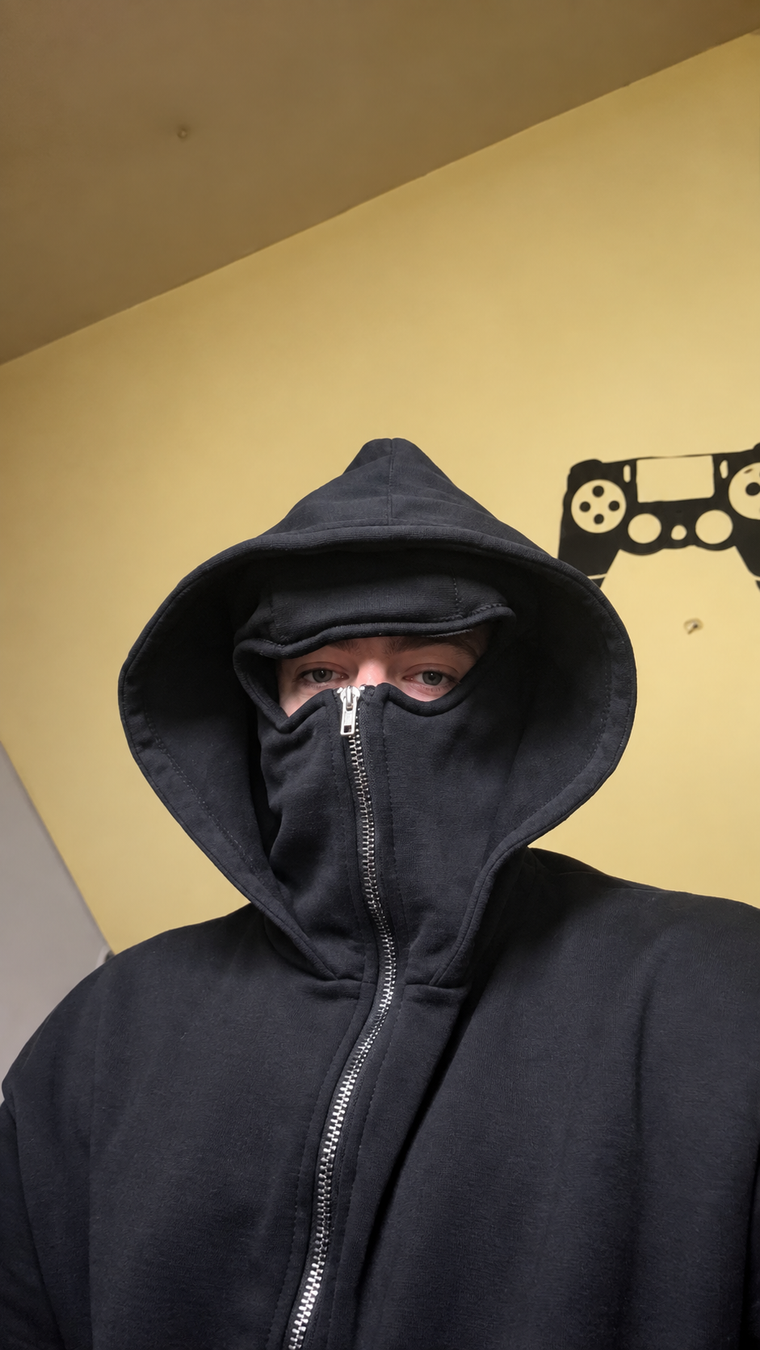 Black balaclava zip hoodie worn indoors