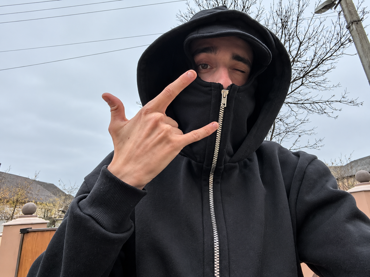 Black balaclava zip hoodie worn outdoors